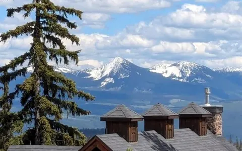 Mountain view over the rooftops from the upper floor