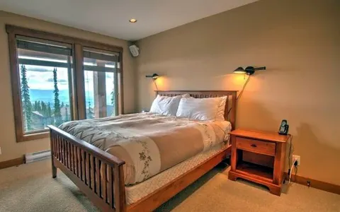 Bedroom with mountain-view window