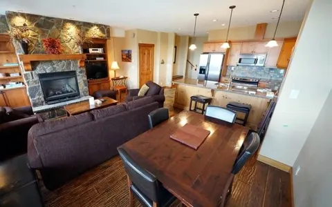 Open-concept living and dining with hardwood floors