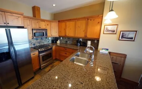 Kitchen with stainless appliances and granite counters