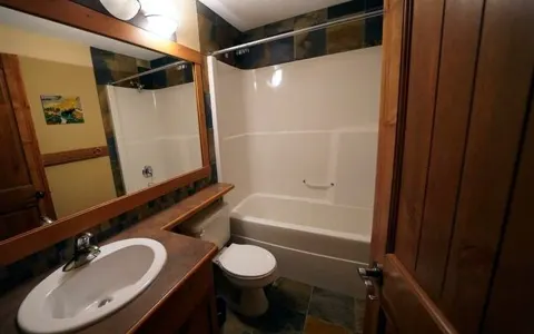 Main bathroom with tub and shower