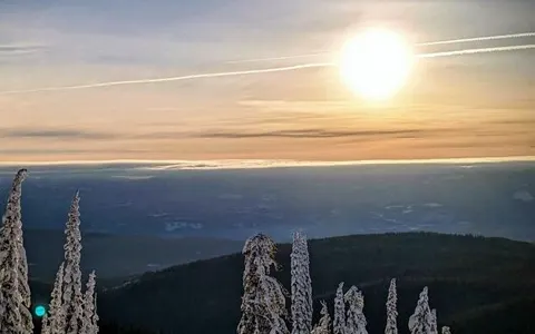 Sunset over the valley from the mountain